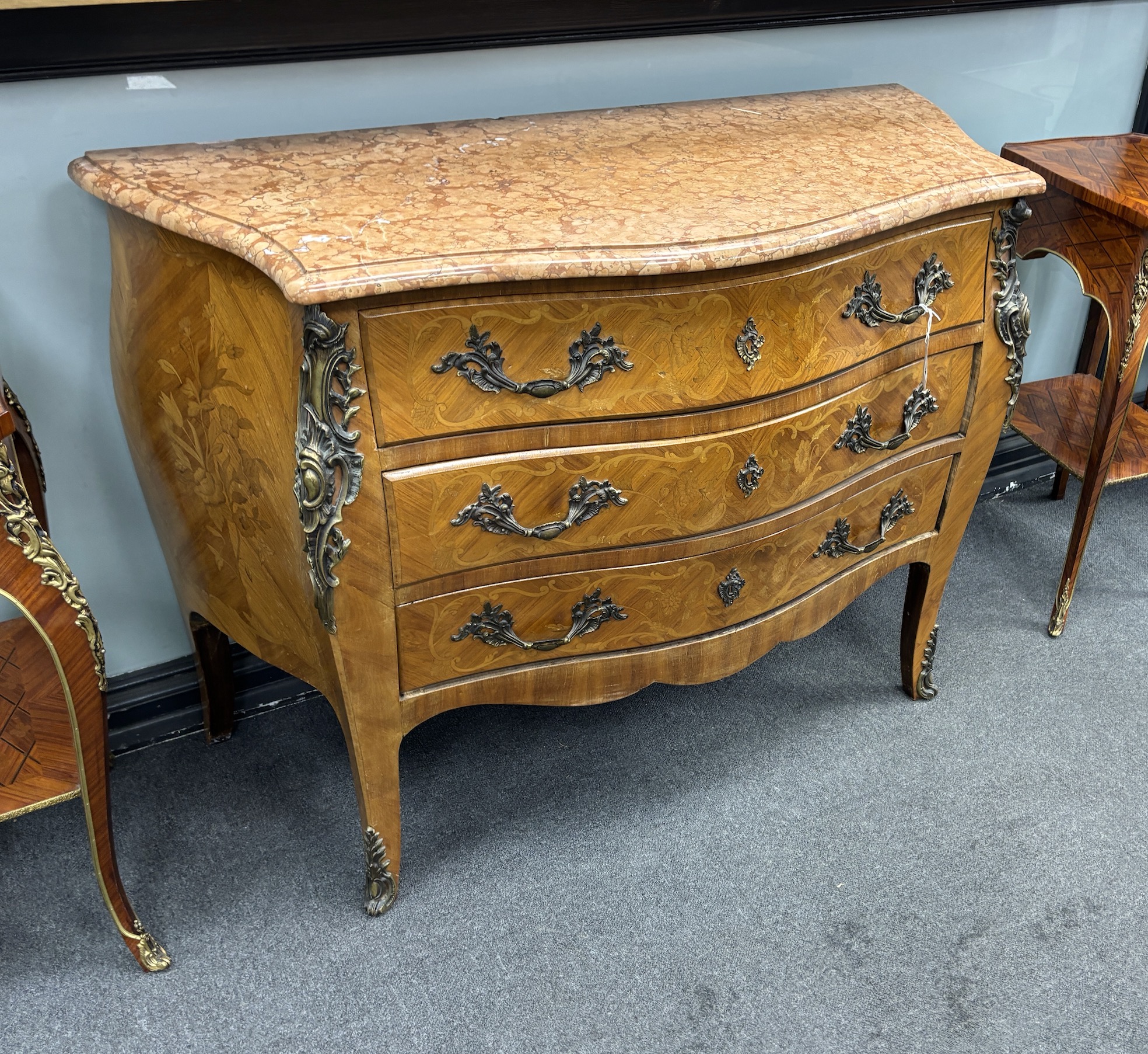 A Louis XV style gilt metal mounted marquetry inlaid marble topped bombe commode, width 118cm, depth 51cm, height 88cm